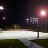 Lighted basketball court at night