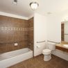 Accessible bathroom with grab bars and tub