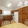 Kitchen and dining area with oak cabinets