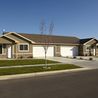 Single-level home with two-car garage and front lawn