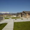 Street of homes with sidewalks and mountain views